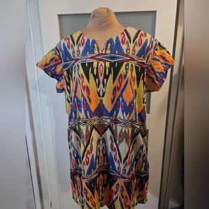 The UNCLE FRANK Dress is a vibrant and colorful African-inspired dress designed